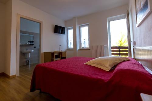 Ein Bett oder Betten in einem Zimmer der Unterkunft Hotel Ristorante Miravalle