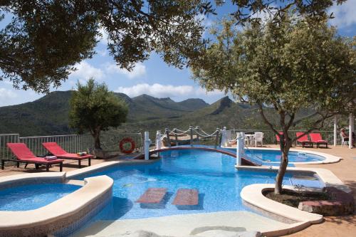 a swimming pool with a view of mountains at Agroturismo Sa Duaia in Artá