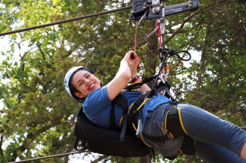 a man on a zip line in the trees at Holiday Inn At Six Flags Saint Louis by IHG in Eureka