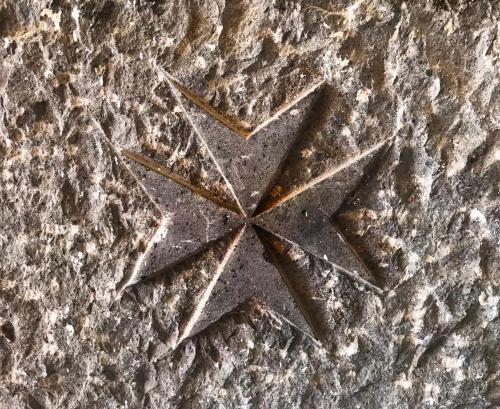 a stone floor with a star on it at Hotel Croce Di Amalfi in Amalfi