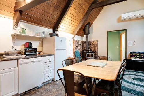 a kitchen and dining room with a table and chairs at Cedarwood Grove in Baring