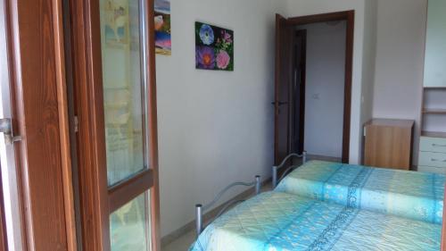 Letto o letti in una camera di B&B La Posada Stintino