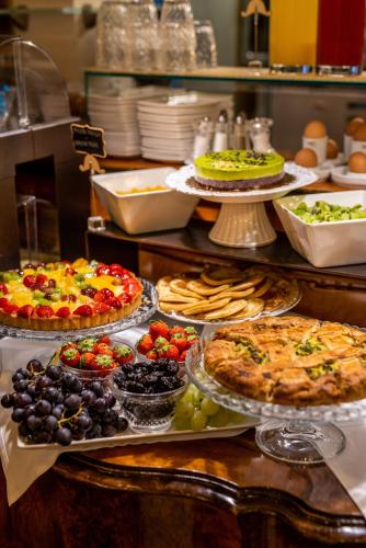 a buffet with many different types of food on display at Hotel Santo Stefano in Venice