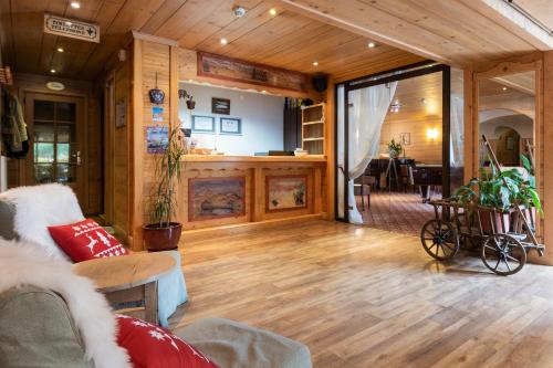 a living room filled with furniture and a fireplace at Hotel La Montagne in La Clusaz