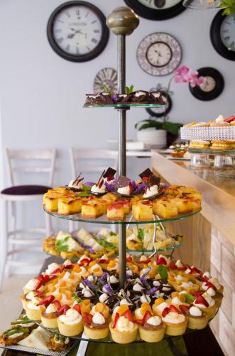 a three tiered display of different types of food at Lodge on Main Guest House and Conference Centre in Port Elizabeth