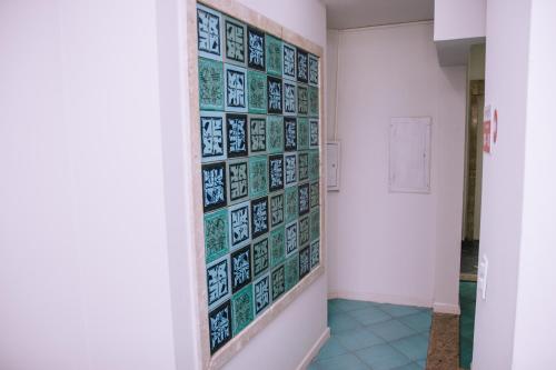a hallway with tiles on the wall at SAMIR HOTEL COMFORT in Porto Velho