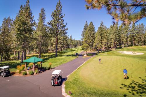 an aerial view of a golf course with people playing golf at Tastefully-Updated, Classic Tahoe Family Home in Truckee