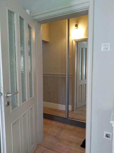 a hallway with a door leading into a room at My Home, with free secure parking in Stara Zagora