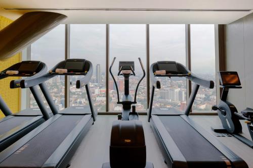 a gym with five treadmills in a building at Sofitel Mexico City Reforma in Mexico City