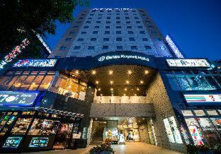 a large building with a store in front of it at Daiwa Roynet Hotel Sendai in Sendai