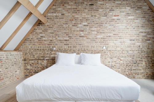 Katil atau katil-katil dalam bilik di Cour 8 Lofts