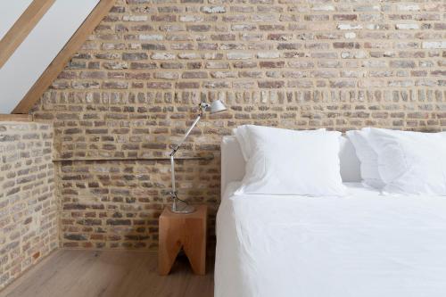 Katil atau katil-katil dalam bilik di Cour 8 Lofts