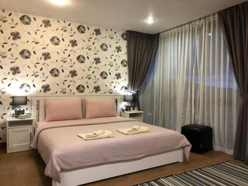 Postel nebo postele na pokoji v ubytování WOW Apartment at Unity Patong