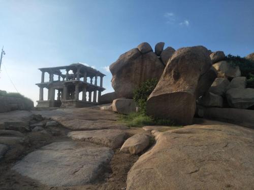a bunch of rocks and a structure on a mountain at Heavenly Homestay in Cochin
