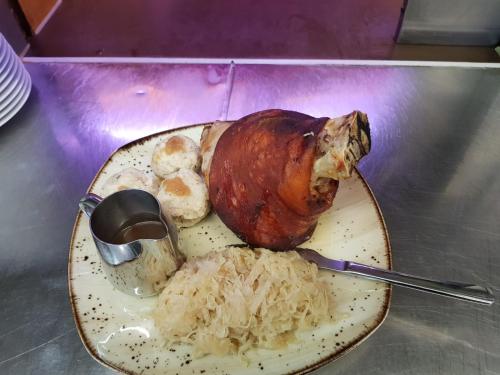 a plate of food with a turkey on a table at Gasthof Liederhalle in Aalen