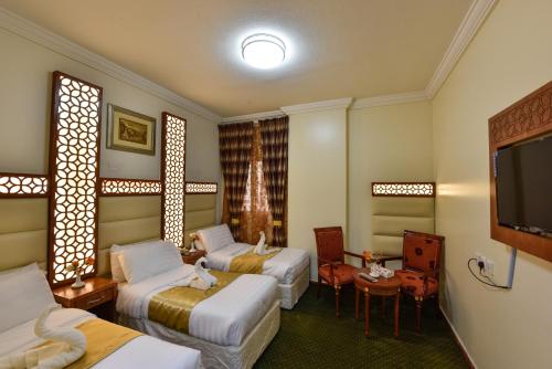 Lova arba lovos apgyvendinimo įstaigoje Al Mukhtara Al Gharbi Hotel
