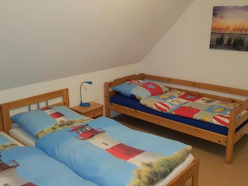 Кровать или кровати в номере Ostsee 1