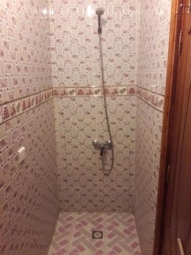 a bathroom with a shower with a toilet in it at appartement traditionnel et contemporain, au coeur du kasbah in Tangier