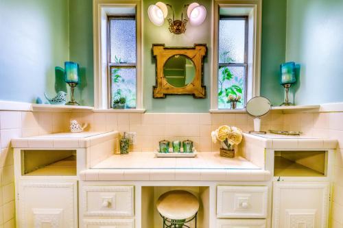 a bathroom with two sinks and a mirror at The Harrison House in Boise