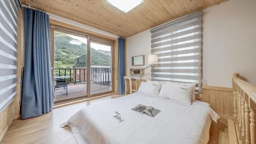 מיטה או מיטות בחדר ב-Mokkoji Pension