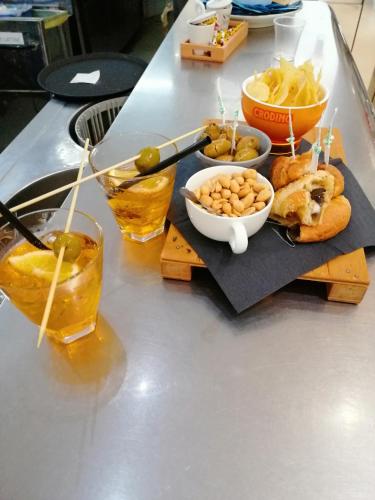 a table topped with a tray of food and drinks at Holiday Home Zolfare in Comitini
