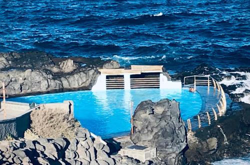 a swimming pool in the middle of the ocean at Bruno´s House Apartment View in Pájara