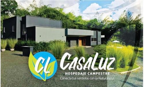a sign in front of a house at CASA LUZ Hospedaje, Pereira , Cerritos in Pereira