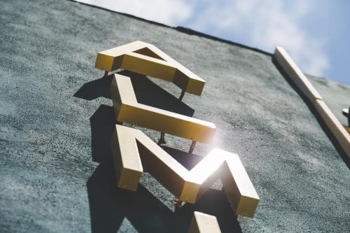 a logo on the roof of a building at Hotel Almirante in Alicante
