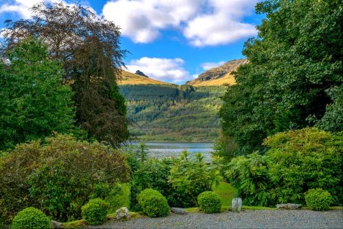 a view of a lake with mountains in the background at Mansefield House in Arrochar