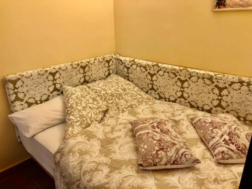 a bed with pillows on it in a room at Hotel Rural Vilaflor Self check in 24h in Vilaflor