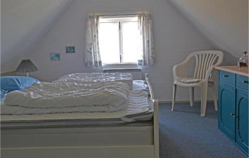 En eller flere senge i et værelse på Amazing Home In Fan With Wifi