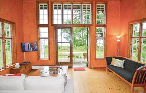 a living room with a couch and a table at Two-Bedroom Holiday Home In Faxe in Faxe