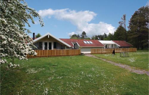 a house with a yard in front of it at Holiday Home Langesøvej in Rørvig
