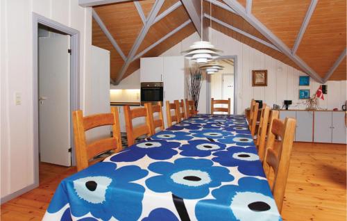 a dining room table with a blue and white table cloth at Holiday Home Langesøvej in Rørvig