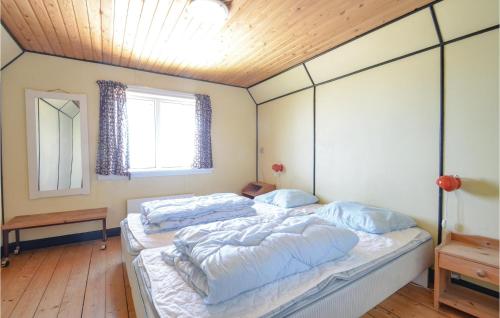 Ένα ή περισσότερα κρεβάτια σε δωμάτιο στο Four-Bedroom Holiday Home In Frostrup