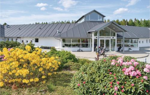 a building with a lot of flowers in front of it at Holiday Home Vemb With Fireplace 07 in Vemb