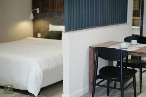 Ένα ή περισσότερα κρεβάτια σε δωμάτιο στο Kaia Residence Danang Quiet Garden