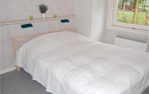 Katil atau katil-katil dalam bilik di Holiday Home Duevænget Humble Xi