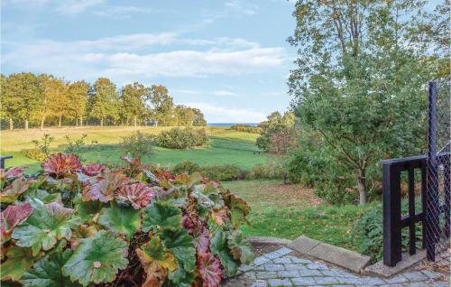 a garden with a view of a field at Three-Bedroom Holiday Home In Asperup in Asperup