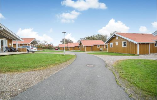a winding road in a residential neighborhood with houses at Skærbæk Fritidscenter in Skærbæk
