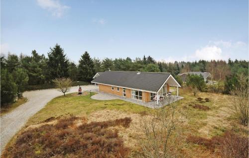 an overhead view of a house on a field at Holiday Home Lyngshuse Xi in Kølkær