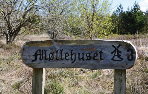 a wooden sign with the word wilderness on it at Holiday Home Lyngshuse Xi in Kølkær