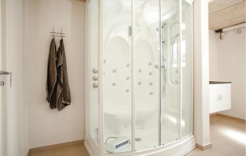 a shower with a glass enclosure in a bathroom at Lukaf in Thyborøn
