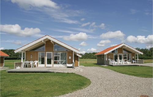 a small house with a porch at Skærbæk Fritidscenter in Skærbæk