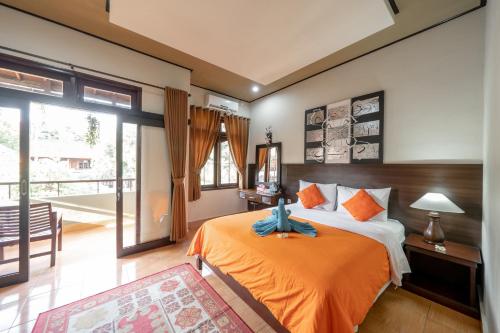 En eller flere senge i et værelse på Bendesa Accommodation