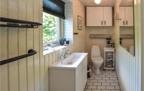 a bathroom with a sink and a toilet at Amazing Home In Broager With Wifi in Broager