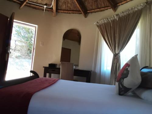 Un ou plusieurs lits dans un hébergement de l'établissement Maluti Stay Lodge