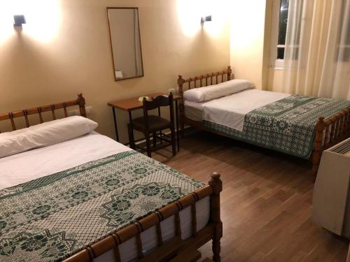 Postel nebo postele na pokoji v ubytování Tulip Hotel