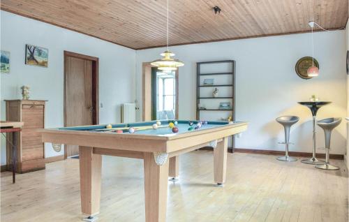 a living room with a pool table in it at Klitgaarden in Kryle