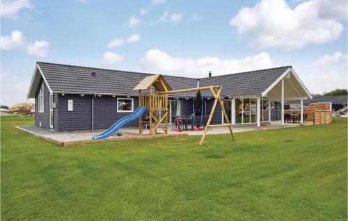 a house with a slide and a playground at Beautiful Home In Sydals With Wifi in Høruphav